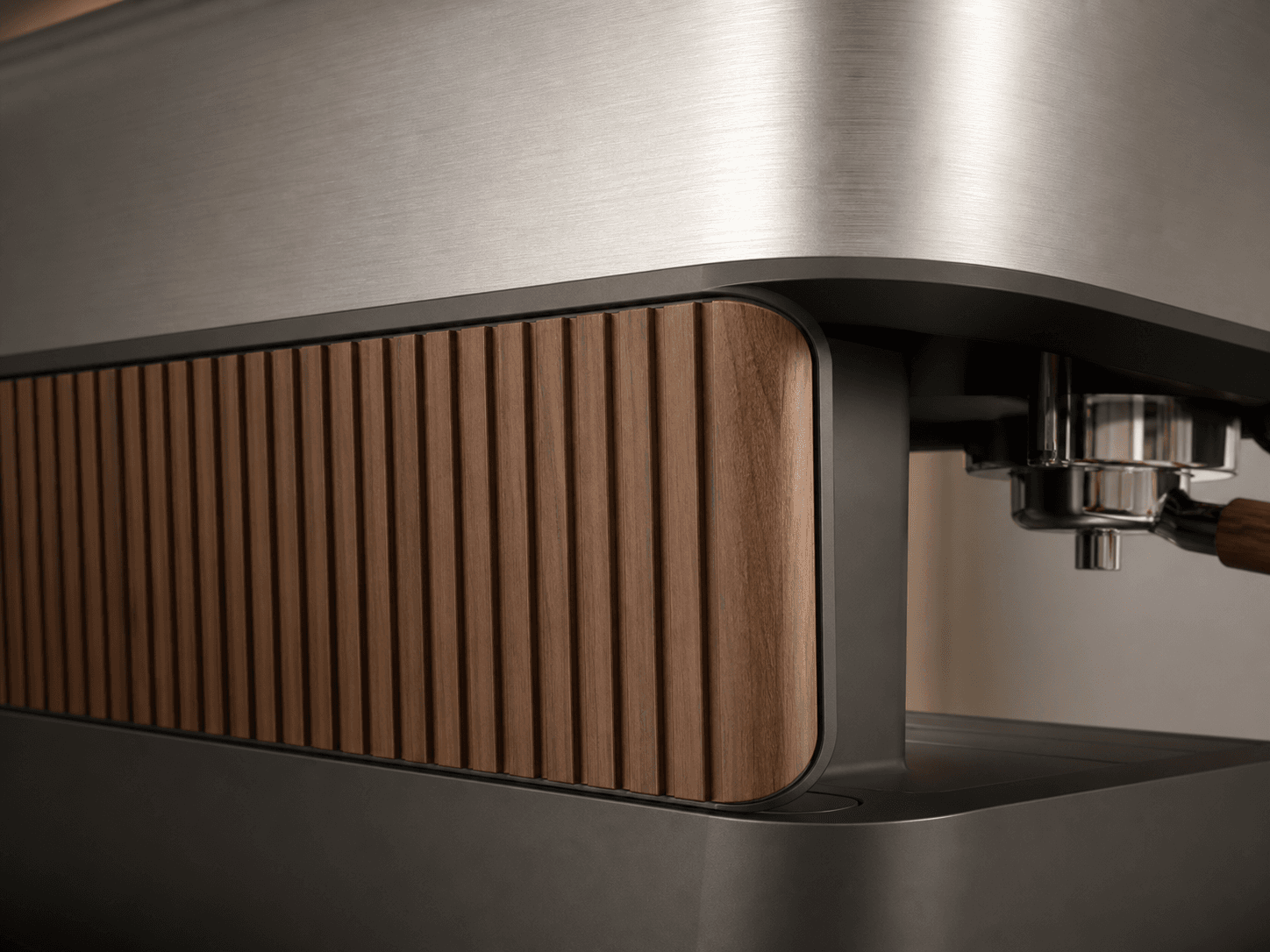 Material detail — brushed steel & ribbed walnut